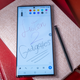 A photo of the Galaxy S22 UItra with an undocked S Pen at the side